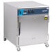 An Alto-Shaam undercounter cook and hold oven with stainless steel exterior on wheels.