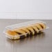 A Dart clear plastic container of strudel.