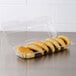 A Dart clear plastic container holding six strudels.