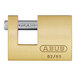 An ABUS brass padlock with the words "ABUS" on it.