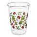 A clear plastic cup decorated with Christmas-themed images such as trees, presents, holly, candy canes, and snowflakes.