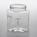 A clear plastic square jar with a lid.