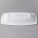 A white rectangular Libbey porcelain bowl with a logo.