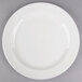 A Libbey white porcelain plate with a round rim on a gray surface.