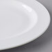 A close up of a Libbey white porcelain platter with a small rim.