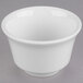 A Libbey white porcelain bouillon bowl with a lid on a gray surface.