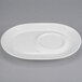 A white plate with a round center and oval rim.