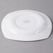 A Libbey square white porcelain plate with a circular design on it.