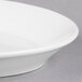 A Libbey white porcelain platter with a rim on a white background.