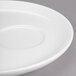 A Libbey Royal Rideau white porcelain saucer with a round edge and a circular offset well.