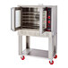 A commercial stainless steel single-deck convection oven with an open door, multiple racks, control knobs, and red caster wheels.