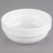 A white Libbey Slenda stacking bowl on a gray surface.