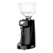 A Victoria Arduino black coffee grinder with a clear glass container.