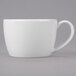 A close-up of a Libbey white espresso cup with a handle.