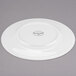 A Libbey white porcelain plate with a circular design on the rim.