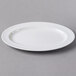 A white Libbey Slenda oval porcelain platter on a gray surface.