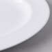 A close up of a Libbey white porcelain platter with a wide rim.