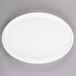 A white Libbey oval porcelain tray with a white rim.