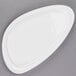 A white oval Libbey porcelain plate with curved edges.