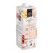 A white carton of 1883 Maison Routin Peach Smoothie Mix with peach and apple illustrations.