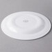 A Libbey white porcelain plate with a circular design on the rim.