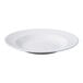A white round porcelain entree and pasta bowl with a wide rim and shallow center.