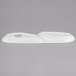 A white porcelain oval serving tray with two wells.