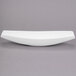 A white Libbey porcelain canoe plate with a curved edge.