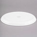 A white porcelain tray with an oval shape and a footed base.