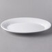 A white Libbey porcelain platter with a rim on a gray surface.