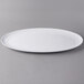 A white Libbey oval porcelain tray.