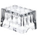 A clear glass Libbey Gibraltar sugar package holder with a curved edge and a handle.