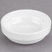 A Libbey Royal Rideau white porcelain stacking fruit bowl on a gray surface.