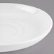A white porcelain soup cup saucer with a rim.