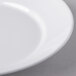 A close up of a Libbey white porcelain entree and pasta bowl with a white rim.