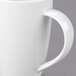 A close-up of a white Libbey Slenda porcelain mug with a handle.