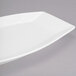 A white Libbey rectangular porcelain serving tray with a curved edge.