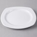 A white Libbey square porcelain plate on a gray surface.