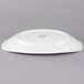 A white Libbey porcelain handle platter with a circular rim.