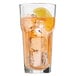 A Libbey Gibraltar cooler glass of iced tea with a lemon slice.