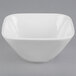 A white square bowl with a curved edge.