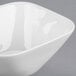 A white Libbey square porcelain bowl on a white surface.