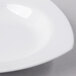 A close up of a Libbey white square porcelain deep rimmed soup bowl.