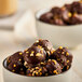 A bowl of Eclipse Foods Bonbons, chocolate covered almond ice cream bites.