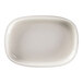 A white porcelain oval plate with a white rim.