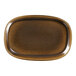 A brown oval porcelain plate with a white background and brown rim.