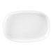 A white oval deep porcelain plate.