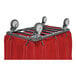 A red R&B Wire laundry cart with a metal frame and swivel casters.