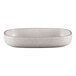 A white RAK Porcelain oval deep plate with speckled design.