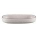 A white oval RAK Porcelain deep porcelain plate with speckled specks on the surface.